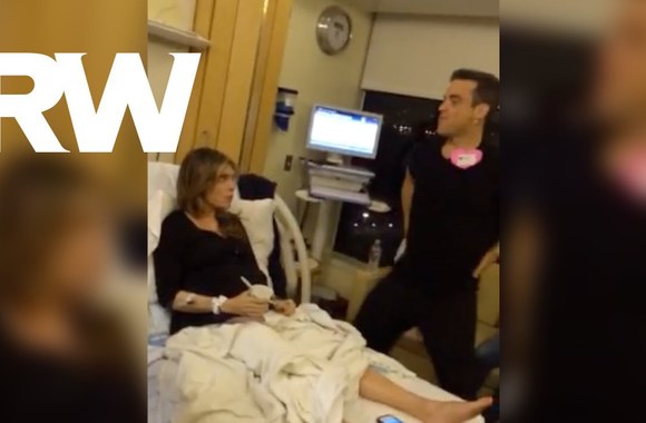 VIDEO kadras: Robbie Williamsas šoka gimdančiai žmonai