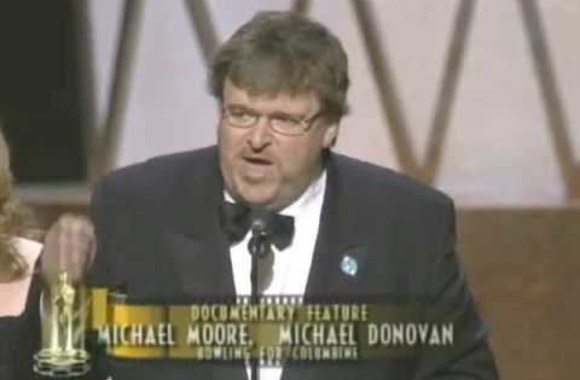 michael-moore-winning-an-oscar-for-bowling-for-columbine