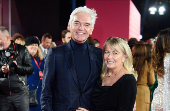 Phillipas Schofieldas su žmona Stephanie Lowe/Vida Press nuotr.