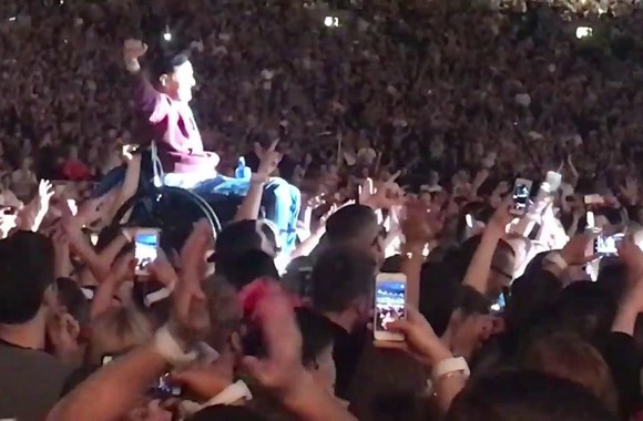 guy-in-wheelchair-crowd-surfs-to-join-coldplay-on-stage-in-dublin